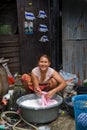 A woman living in a slum doing laundry